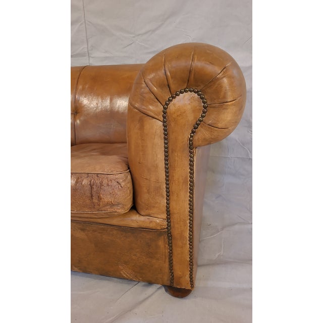 Beautiful vintage leather sofa in a rich camel leather. Oversized, stuffed arms give this a chesterfield style feel...