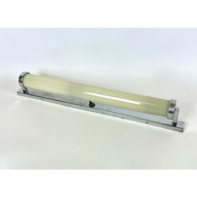 Bauhaus Nickel-Plated Tubular Wall Lamp from Napako, 1930s, in Restored conditions. Designed 1920 to 1949 This piece is...