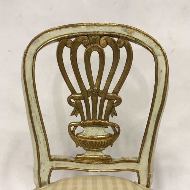 A darling gilded and carved side chair perfect for your boudoir or powder room.