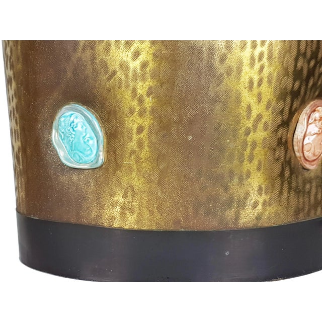 This elegant umbrella stand was manufactured in Italy in the 1950s. It is made from an engraved brass sheet with two black...