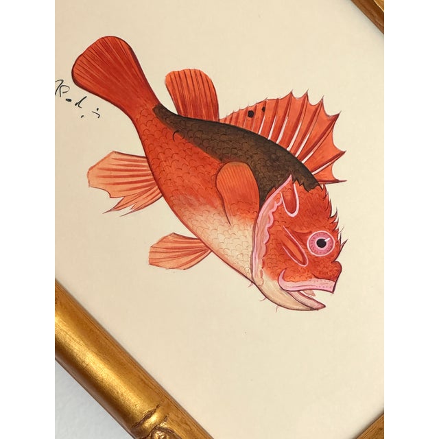 This hand-painted fish comes alive through its rich coral reds, soft peach tones, and deep earthy accents, beautifully...