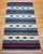 This vintage Southwestern kilim rug, part of our curated Americana Collection, features a bold and balanced design with...