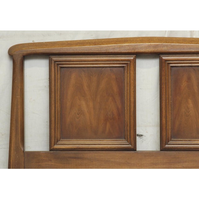 Mid Century Modern wooden twin size headboard. It features two inset panels and a slight tapering in the design, giving...