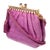 This vintage Judith Leiber fuchsia pink karung snakeskin evening bag features a stunning gold-plated frame embellished...