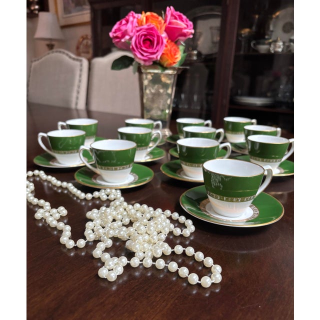 Vintage Twelve demitasse cup and saucer set in Antigua by Royal Crown Derby. Gorgeous green and gold with a geo design on...