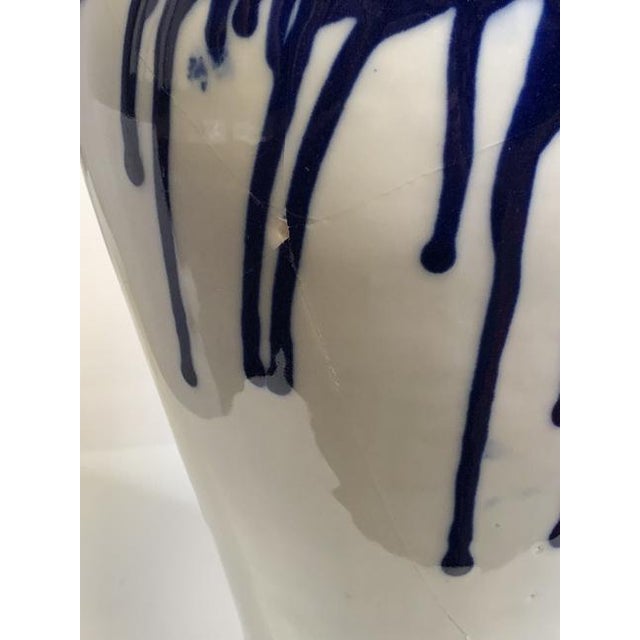 Cobalt Blue and White Vase – 8” x 8” x 10” This striking cobalt blue and white ceramic vase features a bold, contemporary...