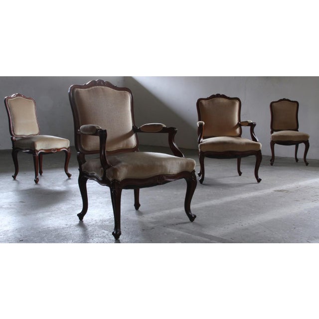 This elegant pair of hand-carved and decorated wooden rococo Lounge Chair from the mid-18th century embody that timeless...