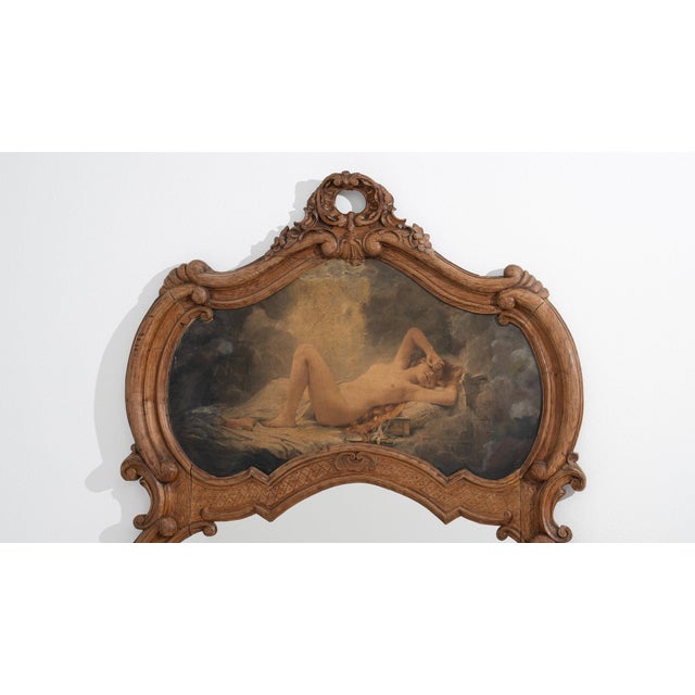This framed oil painting carries genuine presence, its ornate gold gilt frame, figural nude subject immediately setting...
