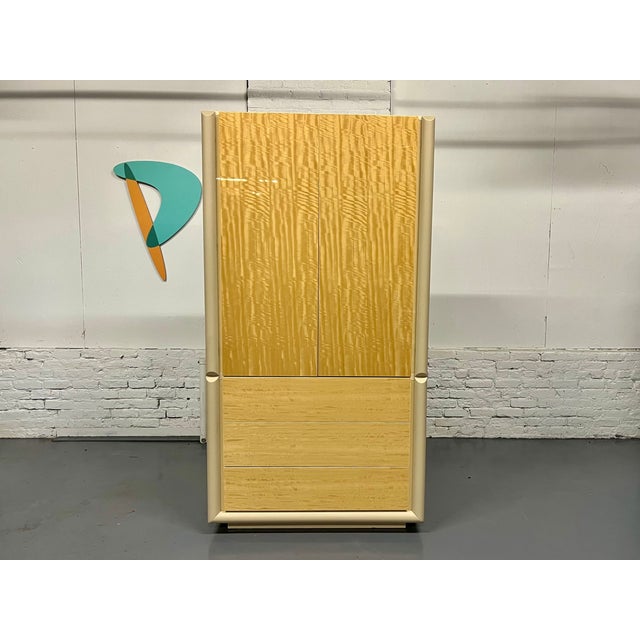 Dramatic lacquered wardrobe with satinwood doors and leather trim from Italian design house Giorgio Collection. This is...
