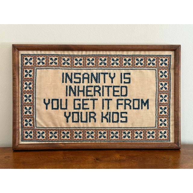A vintage framed cross stitch quippy textile. Handmade and fun. Please see condition details noted. Most items found at...