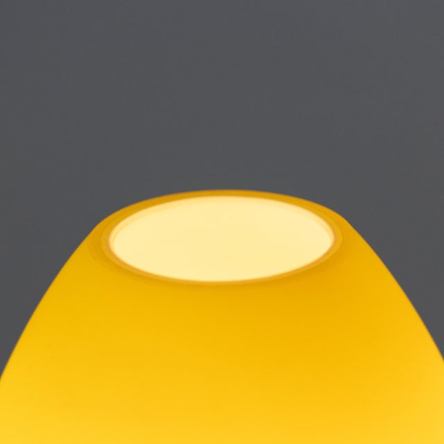 Pair of tripod glass table lamps, white interior, yellow exterior. In working order. European Plug (up to 250V).The wiring...