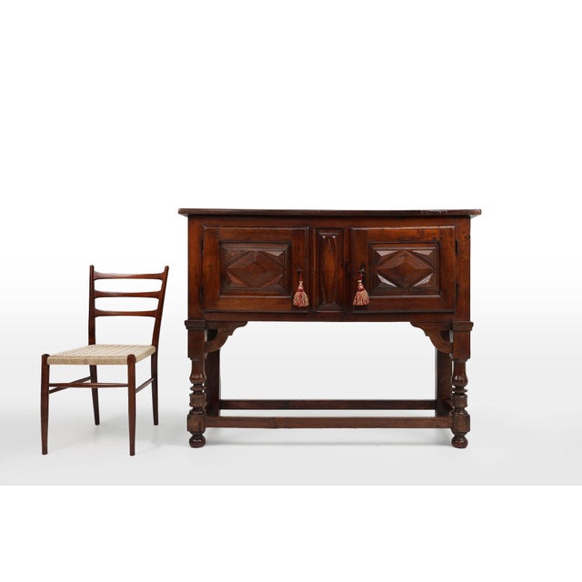 A stunning Spanish antique highboard or cabinet in warm oak wood with two doors from the 16th century. The cabinet has its...
