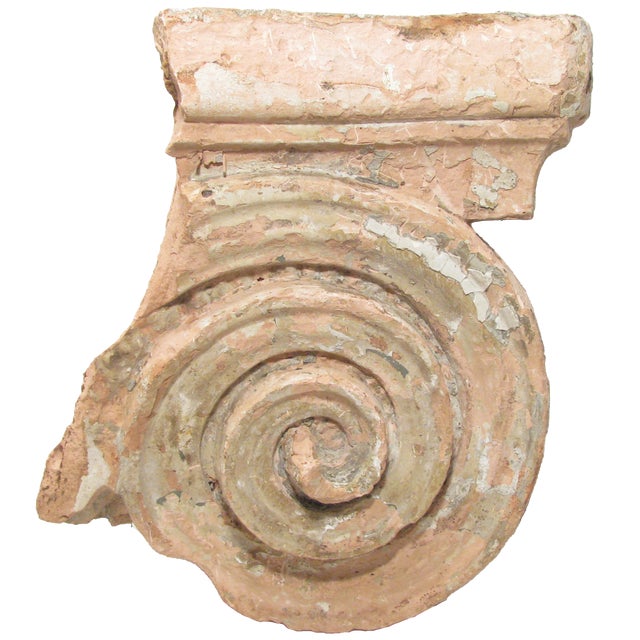 Lovely, ornate terra cotta salvage piece from an elegant 19th century home or office building. A fragment of an Ionic...