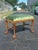 An elegant early 20th-century walnut bench executed in the Queen Anne taste, featuring graceful cabriole legs terminating...