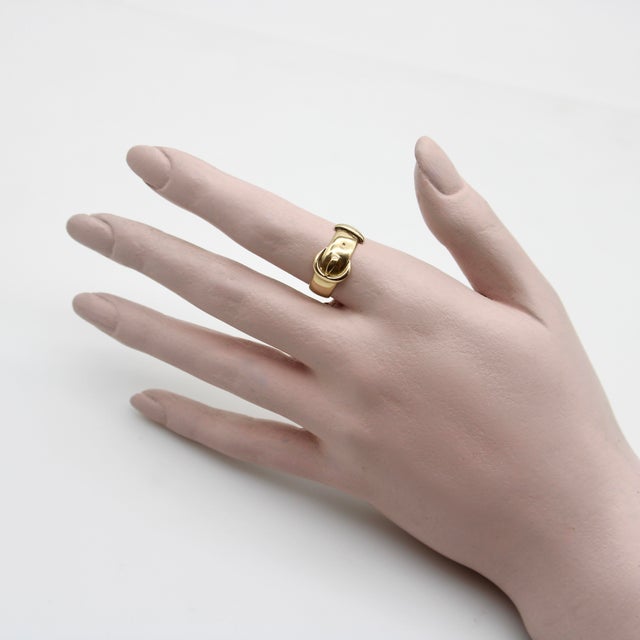 This is part of Chairish’s Fine Jewelry assortment. Made in England in 1919, this 18k gold buckle ring is an Edwardian...