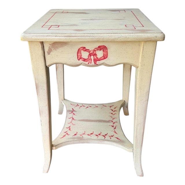 Vintage European Style Hand-Painted Side Table – Italian-Style Cream Finish With Red Bow Motif – Distressed Country Accent For Sale