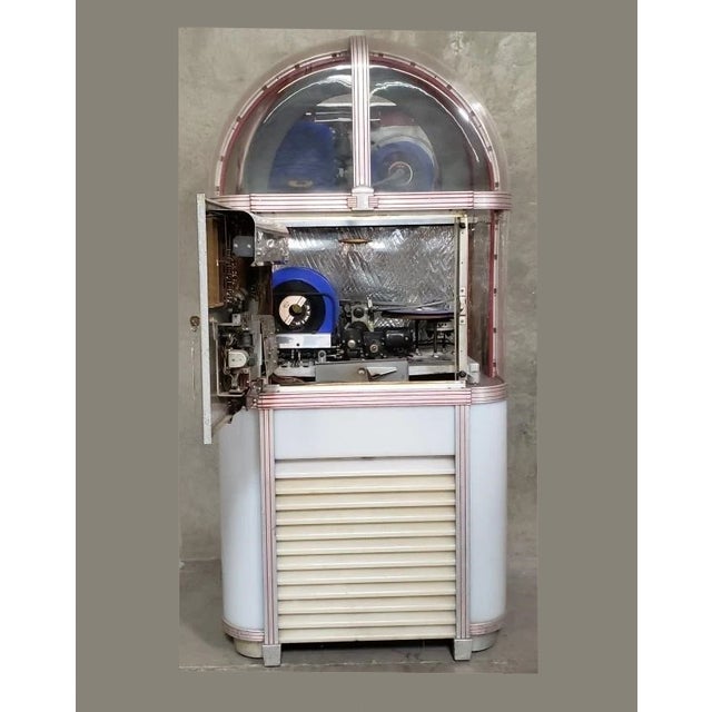 Gorgeous Jukebox in Good Vintage Condition. Solid and Firm. The Jukebox has been untested and it may require rewiring....