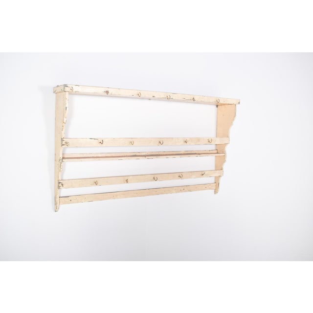 This simple yet charming plate rack embodies the rustic character of traditional Portuguese kitchens. Painted in white...