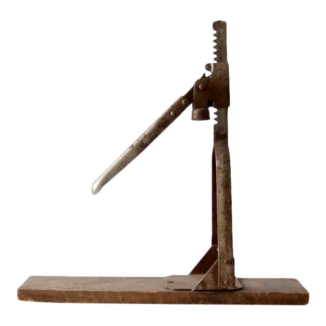 This early 20th-century bottle capper, crafted by the Indestro Manufacturing Company of Chicago and patented November 21,...