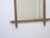 This weathered bamboo mirror measures 31"H x 24"W.
