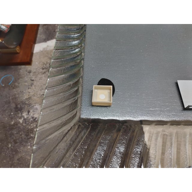 Mid Century wavy glass framed mirror. Unique design with a single piece of glass making up the mirror's frame and the...