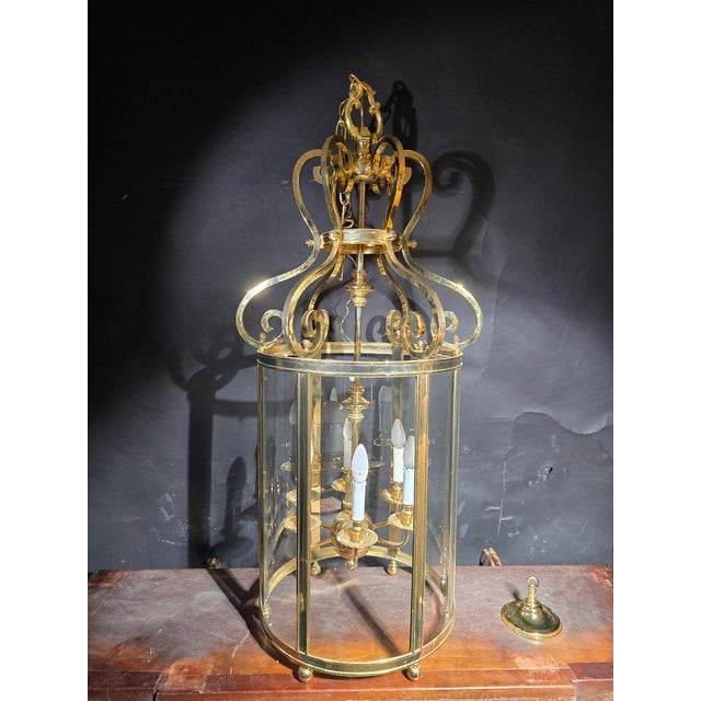 This striking and decorative lantern from the 1950s is crafted from gilt bronze and glass, combining elegance with a...
