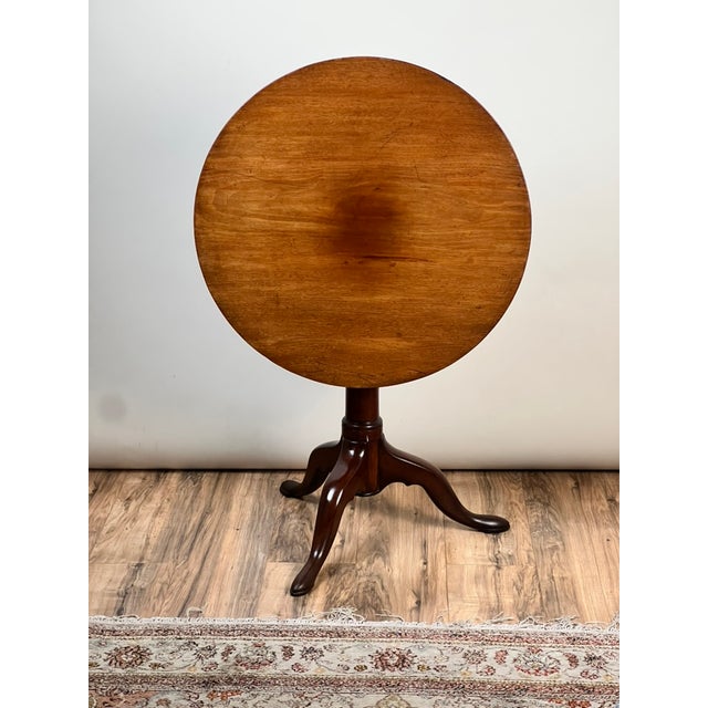 This beautiful antique Queen Anne mahogany birdcage tilt top breakfast table dates to the early 19th century and reflects...