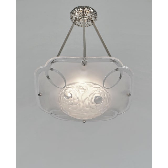 Degué A signed French art deco hanging fixture around 1930 in nickel plated bronze or solid brass holding a large bowl by...