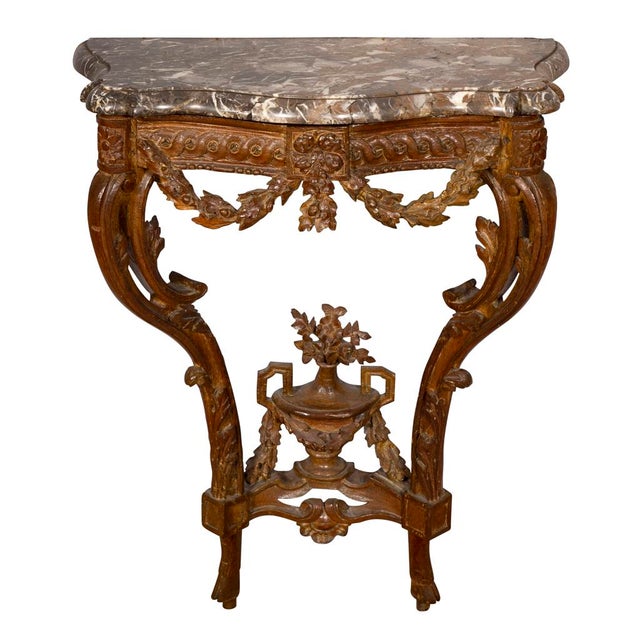 With original shaped marble top on a conforming base with guilloche carved frieze with carved oak leaf swags with a touch...
