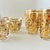 A dazzling and rare Mid-Century Modern Culver Ltd. “Jeweled Ornaments” glassware set, richly decorated in raised 22-karat...