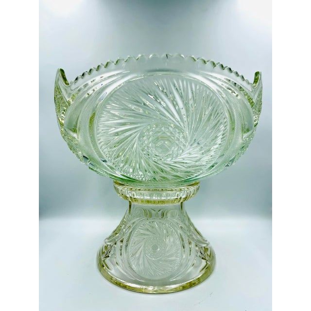 This absolutely beautiful and substantial mid-century punch bowl is a showstopper! Designed by L. E. Smith in the "Aztec"...