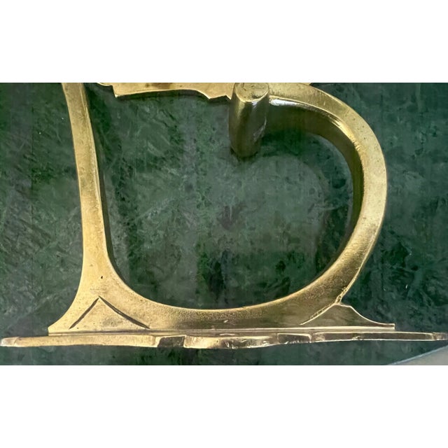 Set of two Art Deco brass double hooks made in France in the 1930's. Originally made for hats on top and coats on the...