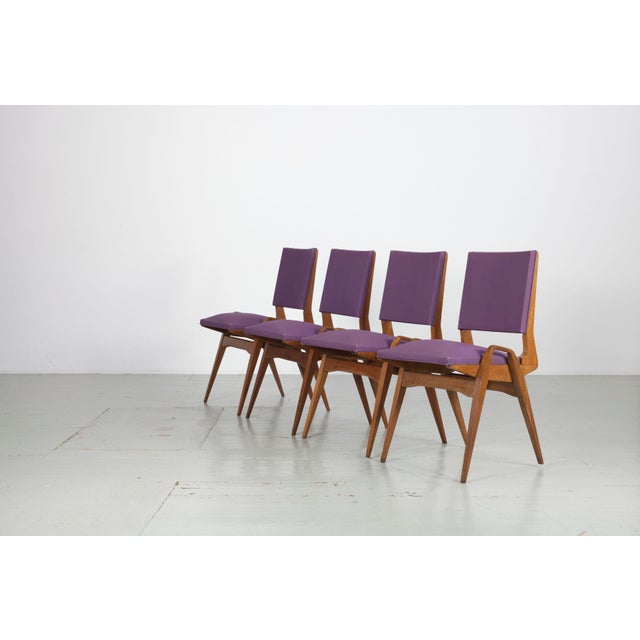 This set of four chairs by Maurice Pre from the 1950s shows typical signs of wear. The mauve skai is original; there is...