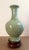 Chinese celadon floral haitangzun vase, a garlic headed vase, covered by a celadon glaze on the exterior and interior and...