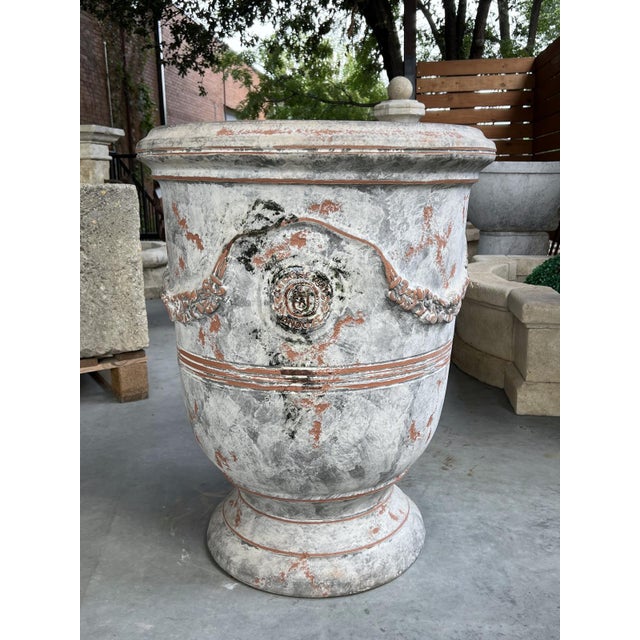 More information coming soon… Known as an Anduze pot, this terracotta planter measures 31 1/2 inches tall. The pot has a...
