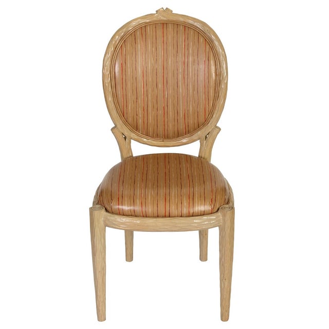 A set of four faux bois dining chairs crafted with an organic, branch inspired frame that beautifully mimics the texture...