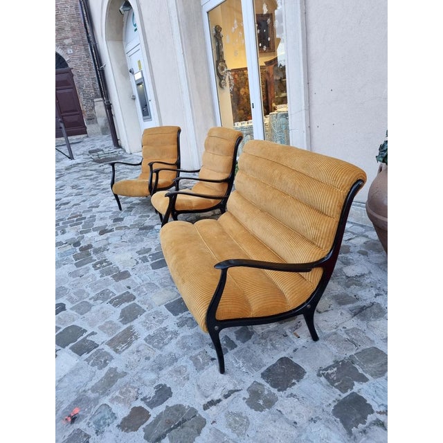 Rare and elegant sofa in curved and black lacquered beech wood with rare and intact original yellow ocher velvet padding...