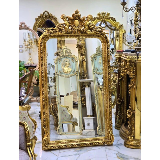Make an unforgettable statement with this magnificent French Rococo floor mirror, exquisitely crafted with an ornate frame...