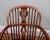 Attractive pair of Windsor armchairs with warm brown tones and traditional country house appeal. Perfect for that...