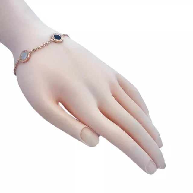 Elegant and authentic by Bulgari, this 4 disc motif bracelet is crafted from 18k rose gold with a polished finish...