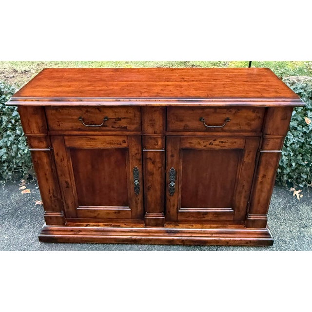 Handsome 2 door sideboard with tons of character and artful distressing. Warm honey toned finish with black glazing,...