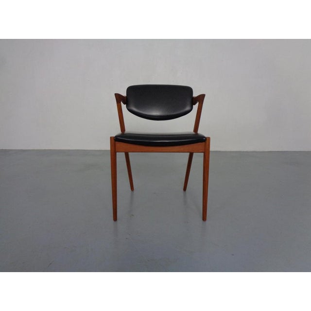 Model 42 teak chair by Kai Kristiansen for Schou Andersen from the 1960s. I have official proof of authenticity such as...