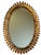 Large oval wrought iron sunburst mirror from the 1950s. Italian handcrafted, decorated with leaves.