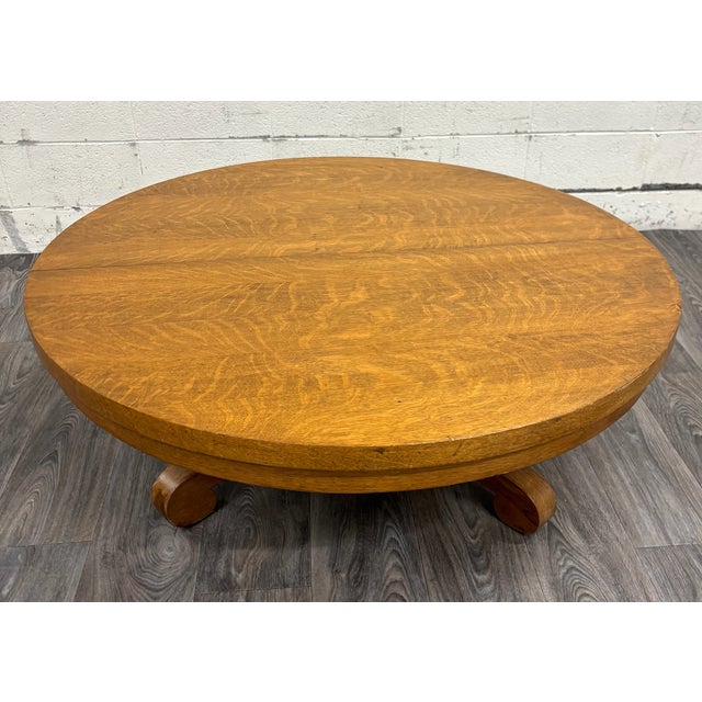 This is a stunning antique Victorian round tiger oak scroll foot pedestal coffee table or cocktail table. Can open to...