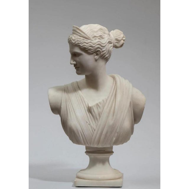 Carrara marble bust of "Diana the Huntress," late 19th/20th century, Italy. Height x Width x Depth: 42 x 27 x 17 cm....