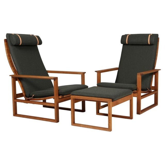 A Børge Mogensen pair of lounge chairs and ottoamn designed in 1956 model number 2254 for Fredericia Stolefabrik. Cubical...