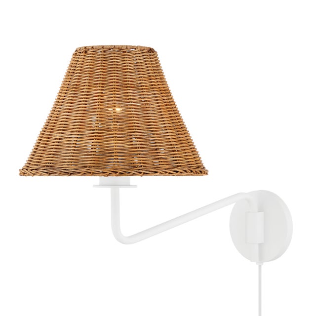 Issa has a natural style that's ahead of the curve. Slender, hooked arms hold a woven rattan shade that lets a soft light...