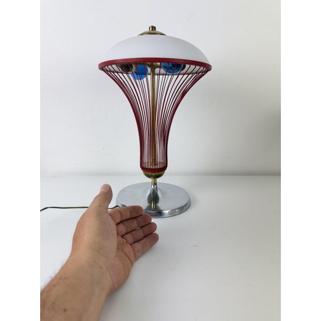 Space Age table lamp, Made in Italy, 1970s The central structure is a cage of curved red enameled metal wires topped with...