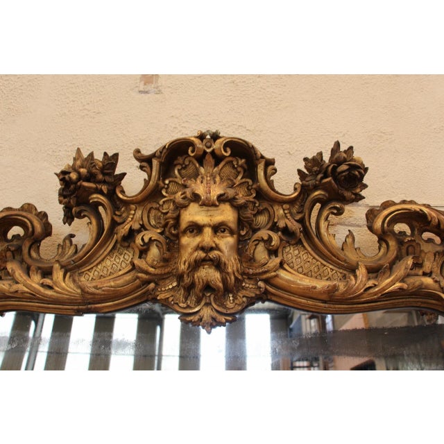 Large giltwood mirror, 19th century retains its original parquet backing overall in good condition, minor losses and wear...
