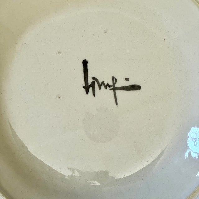 A stunning and rare Jurg Lanzrein hand-painted ceramic decorative plate with a whimsical modern colorful illustration....